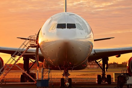 Front of Airplane with sunset in background
